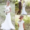 Country Garden Lace Wedding Dresses Mermaid V Neck Cap Sleeve Wedding Bridal Gown Boho Beach Covered Button Reception Party Gowns