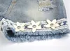 Sommer koreanische Kinderkleidung Mädchen Anzug Chiffon Kuchen Schlinge Hosen 2 Stück Perle Blume Neckholder Top Denim Shorts Kinder S2506814