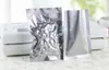Il pacchetto di fogli di alluminio argentato con sigillo termico insacca l'imballaggio della bustina di tè in lamina di Mylar con superficie liscia e piatta aperta QW8963