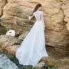 2020 Beach Bohemian Country A Line Abiti da sposa Illusion maniche lunghe Applicazioni in pizzo Maniche lunghe Bottone posteriore Sweep Train Abiti da sposa