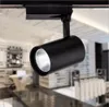 LED Track Light Clothing Shop Light Cob Spotlight AC85- 265V قابلة للتعديل 2 سلكان مصباح الإضاءة المسار للسكك الحديدية لمكتب معرض مول أسود