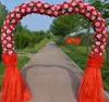 Wielka scena ślubna dekoruje brzoskwiniowe kształt serca łuk Piękny jedwabny kwiat łuk drzwi ślubne Props Dostawa 3394900