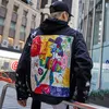 Chaquetas de mezclilla de hip hop de diseñador para hombre Chaquetas de mezclilla pintadas con grafiti de gran tamaño Chaqueta de marca rasgada para hombre Tamaño de calle M-2XL