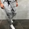 Pantaloni lunghi casuali irregolari da uomo Pantaloni slim da palestra Nuovi pantaloni da corsa solidi Pantaloni sportivi lunghi con coulisse da palestra