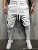 Fashion-Mens Designer rua Pantalones calças listradas botões de design lápis harem calças casuais esportes esportivos