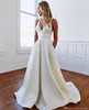 Sexy Erstaunliche reinweiße Satin-Hochzeitskleider A-Linie rückenfrei mit Schleife Brautkleider tiefer V-Ausschnitt ärmellos Vestidos de Marriage Maßgeschneidert