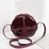 Bolso clásico para mujer Bolso Flores Cartas de charol Muñequera Tortas redondas Diseñadores de lujo Bolsos de hombro para banquetes Bolso de mujer Bolso bandolera