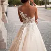 Champagne une ligne robes de mariée 2020 dentelle appliques sans manches bijou pure cou robes de mariée tribunal train robe de mariée avec ceinture de perles