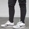 Corriendo pantalones hombres Elástico Boys Fitness Entrenamiento Ropa Deporte Sweetpants Jogger Red Flyny Mens Gym Pantalones