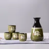 Japansk skulluppsättning asiatiska drycker gåvor med 1 keramisk tokkuri flaska och 4 Ochoko koppar kinesiska kalligrafi svart grön glasyr