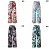 Leg florales pantalones anchos 4 mujeres del color del lazo de la playa del verano suelta impresa flor de bolsillo de pantalón largo LJJ-OO6982