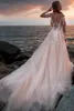 Abiti da sposa sexy a sirena in pizzo bianco Nuovi abiti da sposa con applicazioni a maniche lunghe in maglia trasparente con tulle champagne Vestidos De Soiree