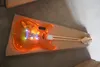 Chitarra elettrica con corpo in acrilico leggero a LED arancione con ponte tremolo piccolo, pickup SSS, personalizzabile