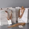 Opakowanie prezentów 5PCS Prosta biała ręczna torba z papierową Kraft do opakowania Odzież Prezenty Torby Książki i torby do dekoracji pakowania 1