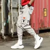 2019 Hombres Multi-bolsillo Diseño de cintura elástica Pantalón Harem Street Punk Hip Hop Pantalones casuales rojos Joggers Hombre Ejército Pantalones cargo Xxxl Y19073001