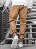 Pantalon de poche d'outillage décontracté tissé pour hommes de style pantalon printemps et automne européen supporte un lot mixte
