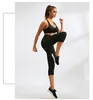 delle donne Capri Leggings morbidi pantaloni atletici pancia Performance Control collant a compressione ritagliata Yoga Pant con Pocket