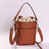 2022 Deporte al aire libre Vintage Cuero genuino Mujeres Bolsas de cubo Diseño simple Samll Bolso Cordón Tote Hombro Crossbody Drew C2282