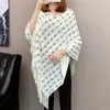 Autumn and winter knitted tassels in the long section of the shawl new loose cape coat female bat shirt