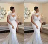 Afrikanisches luxuriöses Hochzeitskleid mit Wrap-Perlenkristall-Frauen-Kleid-Ballgaden kleiner Schwanz-Braut-Hochzeitskleid Kundenspezifische Damenkleider