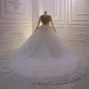 2020 Vintage Långärmad Bollklänning Dubai Bröllopsklänningar Sheer Crew Neck Lace Appliques Beaded Vestios De Novia Brudklänningar med knappar