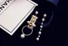 Wholesale- fashion luxury designer long tassel cute bew pearl pendant drop dangle chandelier stud earrings for woman