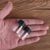 黒のプラスチック帽子スパイス瓶香水瓶の瓶の香水の瓶詰め瓶の付いた100個の部分6ml 22 * 35mmのミニガラスの瓶