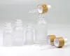 5 10 15 ml 50ml Frostat Clear Glass Dropper Flaskor med Bamboo Cap 1oz Bamboos Essential Oil Bottle Custom Logo