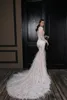 Crystal Design Mermaid Wedding Dresses With Luxury Feathers Jewel Neck Bridal Gowns Long Sleeves Sweep Train Wedding Dress Custom