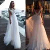 Nuovi splendidi abiti da sposa in pizzo applicato con maniche ad aletta Abiti da sposa Boho Vedi attraverso taglie forti economici