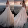 Abiti da sposa sexy a sirena in pizzo bianco Nuovi abiti da sposa con applicazioni a maniche lunghe in maglia trasparente con tulle champagne Vestidos De Soiree