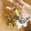 Söt fjäril nyckelring glitter pompom sequins nyckelkedja gåvor för kvinnor väska charms bil nyckelring tillbehör bröllop souvenir