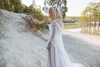 Elegante Brautkleider in A-Linie mit Spitze, transparenter Bateau-Ausschnitt, kurze Ärmel, durchsichtige Knöpfe hinten, Tüll, Sweep-Zug, Robe de Mari￩e