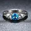 Atacado-europeus e americanos anel Sapphire Topaz anel de noivado oca redonda cobre garra quatro jóias da moda dom acessórios anéis