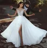 2018 Gorgeous Beach Wedding Dresses Sheer Neck Cap Sleeves Appliques Lace Chiffon Side Split Illusion Back Boho Wedding Gowns Bridal Dresses