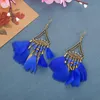 Creative new rice bead earrings super fan-shaped long feather earrings female European and American jewelry wholesale