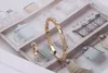 Zestawy biżuterii marki mody lady mosiężne błyszczące odstępy powierzchniowe Diamond wąż wąż 18K złoty ślub zaręczyny Nor Bracelets RI273A