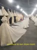 Lange jurk strand trouwjurken bruidsjurken illusie jumpsuits met afneembare trein kant applicaties cap sleeves tule overskirt pocketjurk