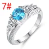 Atacado-europeus e americanos anel Sapphire Topaz anel de noivado oca redonda cobre garra quatro jóias da moda dom acessórios anéis