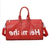 En kaliteli orijinal deri yeni moda erkekler seyahat çantası kadın duffle çanta, marka tasarımcı bagaj çanta büyük kapasiteli spor çantası