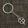 Darmowa Wysyłka 20 sztuk / partia Klucz Pierścień Keychain Biżuteria Posrebrzany Hollow Four Leaf Clover Charms Biżuteria Dokonywanie