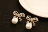 Wholesale-New trendy fashion luxury designer cute sweet beautiful geometric bow elegant pearl stud earrings for woman silver pin