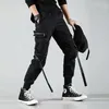 Multi Pocket Hip Hop Streetwear Męskie Black Joggers Pants Men Men Cotton Ribbon Cargo Spodni spodni Elastyczna talia181p