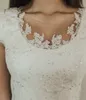 Beaded Lace Modest Wedding Dresses Cap Sleeves Juvel Neck Knappar Tillbaka Korta Ärmar A-Line Bridal Gowns LDS Informell Bröllopsklänning