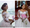 Seksowne afrykańskie sukienki ślubne Linia Złudzenie szyi pełne koronkowe perły koraliki z długim rękawem kaplicy do pociągu kulowego formalne suknie ślubne