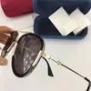 lyxiga designersolglasögon för kvinnor klassiska sommarmodestil metall Ram glasögon Högkvalitativa glasögon UV-skyddslins 0062