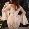 Vedi attraverso abiti da sposa in pizzo Sheer Neck Juliet manica lunga abito da sposa a sirena Dubai African Sexy Back Buttons robe de mariee