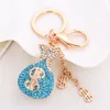 Crystal Keychains المجوهرات نساء الفتيات الفتيات وحيدات الراين الأساسية سلاسل مفتاح الحلقة حامل الدولار الأمريكي تصميم أزياء المعادن قلادة السحر