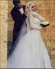 2019 Białe Muzułmańskie Suknie Ślubne Hidżab Wysokiej szyi Saudyjskie Kwiaty Arabskie Długie Rękawy Koronki Zroszony Aplikacja Dubaj Arabski Syrenka Suknie Ślubne