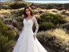 Splendidi abiti da sposa a maniche lunghe con illusione trasparente avorio scollo a V Abiti da sposa in tulle sexy senza schienale in pizzo Robe De Mariage 2019 Nuovo arrivo